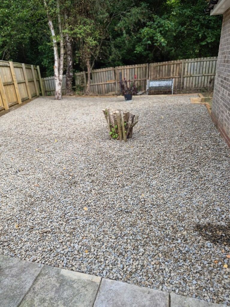 After: the same garden finished with a clean gravel area