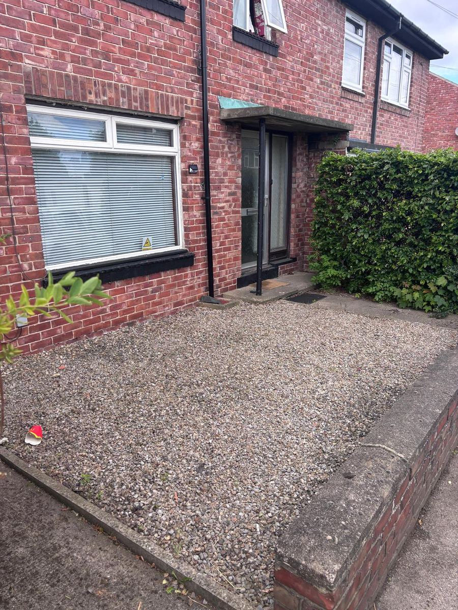 After: the same front garden with clean, weed-free gravel