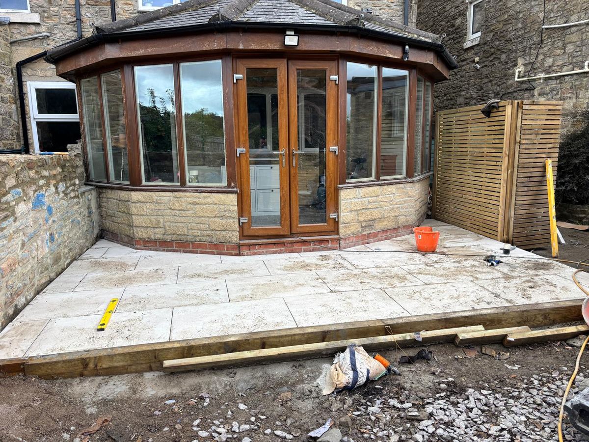 After: porcelain tiles laid on the new patio outside the conservatory